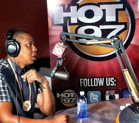 Jay-Z at Hot 97 adorning a chain with the flag of the 5% nation