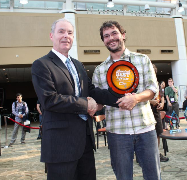 CEO of Coffee Fest David Heilbrunn with the 2nd Place Best Espresso winner in Seattle