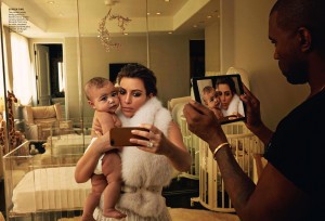 Kim Kardashian takes a selfie of North West while Kanye West snaps a pic of them with his iPad and Photographer Annie Leibovitz catches the moment for Vogue Magazine April 2014