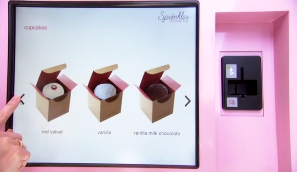 Sprinkles Cupcakes opens NYC’s 1st cupcake atm.  Happy patron purchases a treat