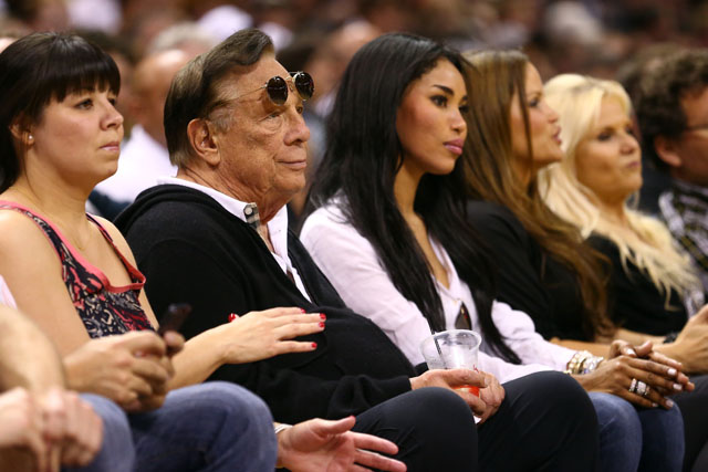 Team owner Donald Sterling of the Los Angeles Clippers and Sugar Baby V Stiviano watch the San Antonio Spurs play against the Memphis Grizzlies during Game One of the Western Conference Finals of the 2013 NBA Playoffs at AT&T Center on May 19, 2013 in San Antonio, Texas. (Photo by Ronald Martinez/Getty Images)