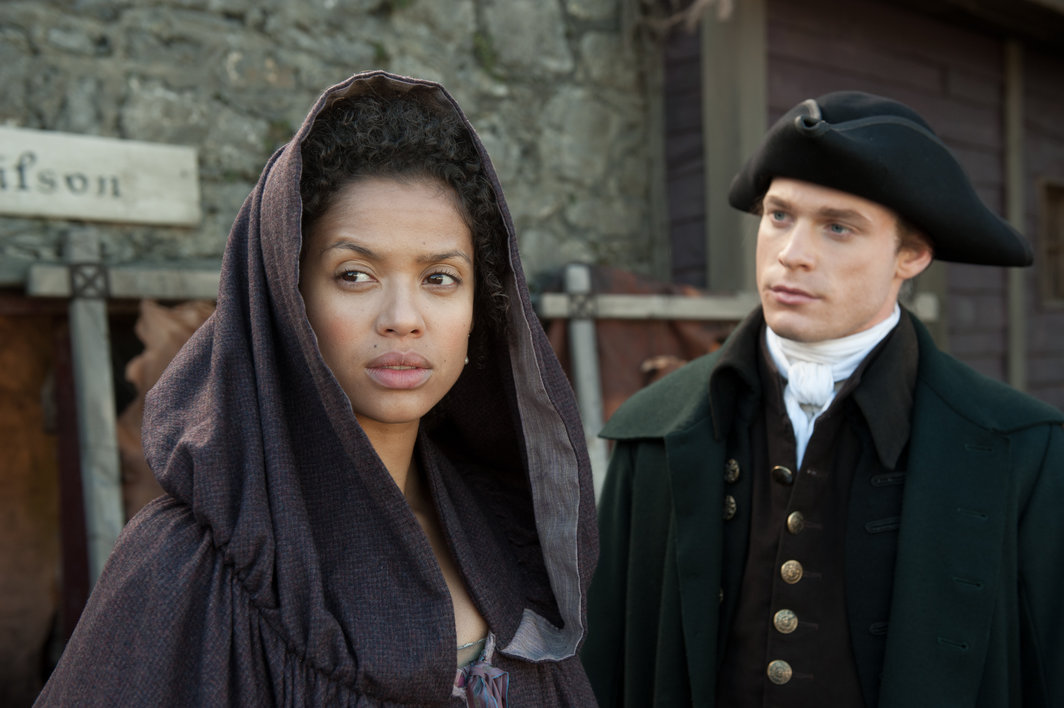 Gugu Mbatha-Raw as "Belle" and Sam Reid as "John Davinier" in BELLE