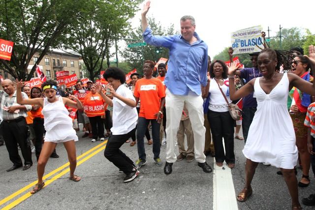 The de Blasio family demonstrate their penchant for parades at the West Indian American Day festivities last year. (AP)