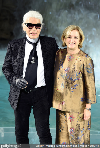 Designer Silvia Venturini Fendi and designer Karl Lager at Fendi Roma 90 Years Anniversary fashion show at Fontana di Trevi in Rome